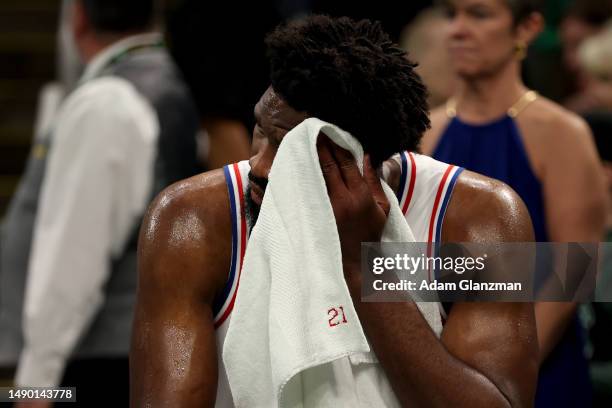 Joel Embiid of the Philadelphia 76ers reacts on the bench against the Boston Celtics during the third quarter in game seven of the 2023 NBA Playoffs...