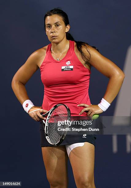 Marion Bartoli of France waits to serve to Yung-Jan Chan of Taipei in their semifinal match during day eight of the Mercury Insurance Open Presented...