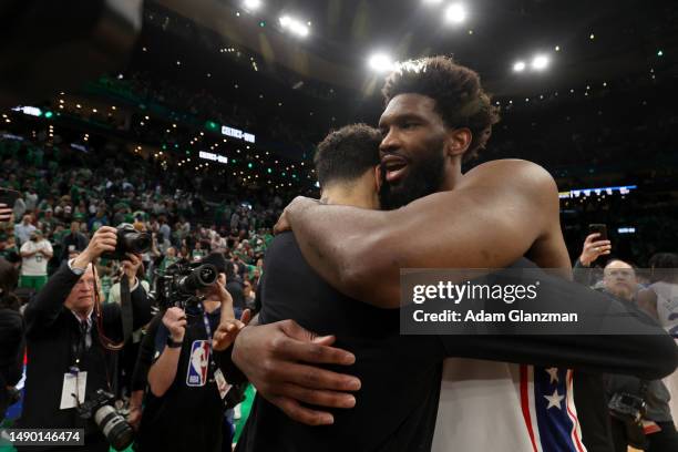 Jayson Tatum of the Boston Celtics and Joel Embiid of the Philadelphia 76ers hug after game seven of the 2023 NBA Playoffs Eastern Conference...