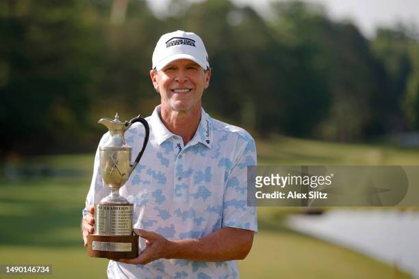 Steve Stricker of the United States poses with the trophy after wining the Regions Tradition at Greystone Golf and Country Club on May 14, 2023 in...