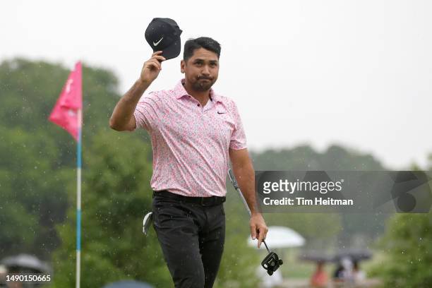 Jason Day of Australia waves to the crowd on the 18th green after finishing his round during the final round of the AT&T Byron Nelson at TPC Craig...