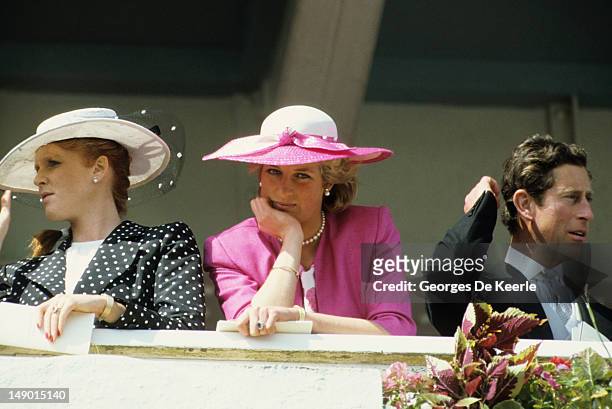 Sarah, Duchess of York, Diana, Princess of Wales and her husband Prince Charles watch the Epsom Derby March 6, 1987 in Epsom, United Kingdom.