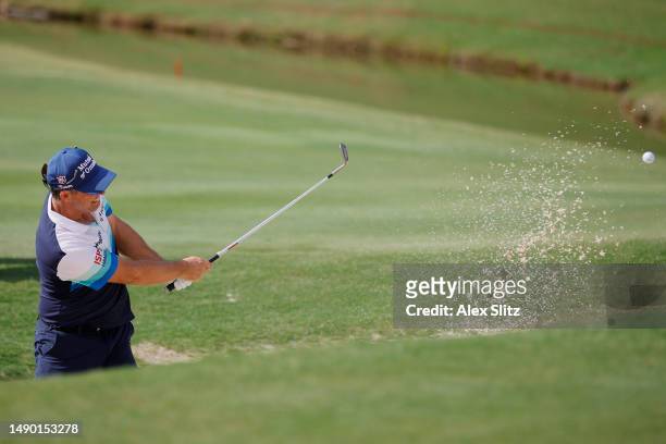 Padraig Harrington of Ireland plays a shot from the greenside bunker on the 18th hole during the final round of the Regions Tradition at Greystone...