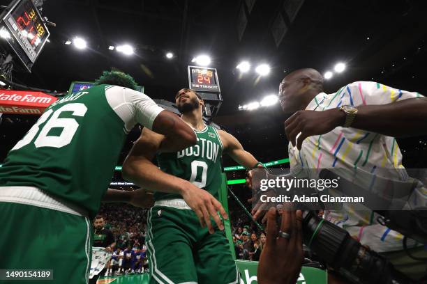 Marcus Smart of the Boston Celtics helps up Jayson Tatum against the Philadelphia 76ers during the fourth quarter in game seven of the 2023 NBA...