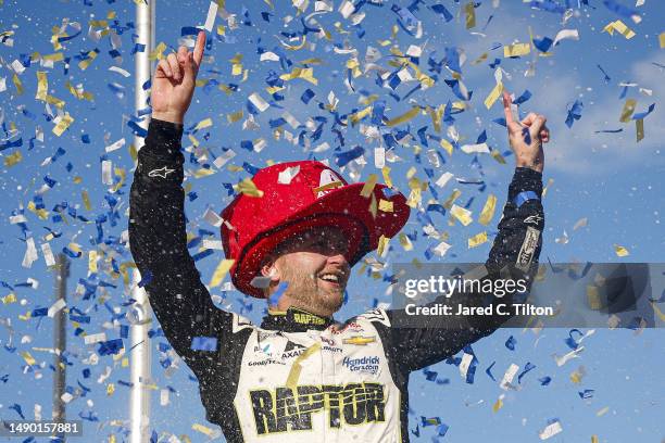 William Byron, driver of the Axalta Throwback Chevrolet, celebrates in victory lane after winning the NASCAR Cup Series Goodyear 400 at Darlington...