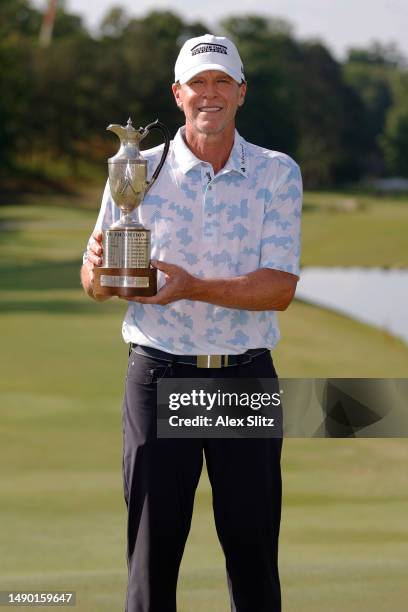 Steve Stricker of the United States poses with the trophy after wining the Regions Tradition at Greystone Golf and Country Club on May 14, 2023 in...