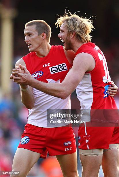 Sam Reid and Lewis Roberts-Thomson of the Swans celebrate a goal by Reid during the round 17 AFL match between the Sydney Swans and the St Kilda...