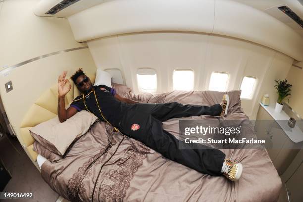 Alex Song of Arsenal FC relaxes in the bedroom on the team flight to Malaysia for the club's pre-season Asian tour on July 21, 2012 in London,...