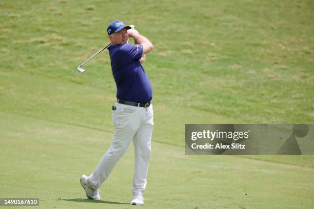 Rod Pampling of Australia watches his shot on the first fairway during the final round of the Regions Tradition at Greystone Golf and Country Club on...