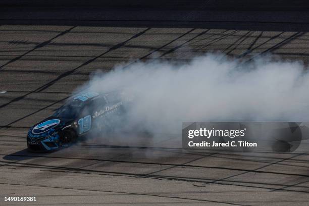 Martin Truex Jr., driver of the Auto-Owners Insurance Toyota, spins after an on-track incident during the NASCAR Cup Series Goodyear 400 at...