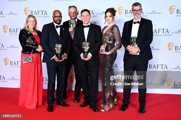 Guest, Marvyn Benoit, a guest, Leo Burley, Hannah Richards and a guest pose in the Winner's Room with the award for the Single Documentary Award for...