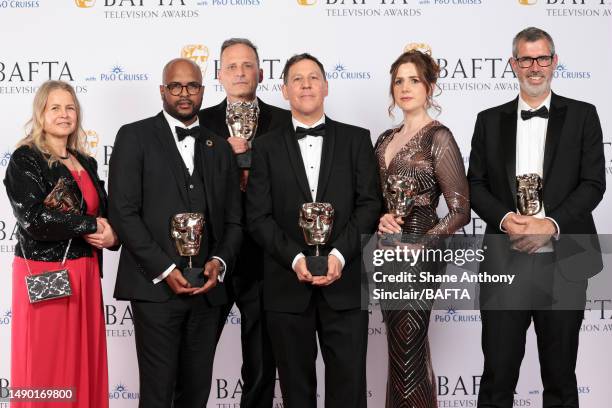 Guest, Marvyn Benoit, a guest, Leo Burley, Hannah Richards and a guest pose in the Winner's Room with the award for the Single Documentary Award for...