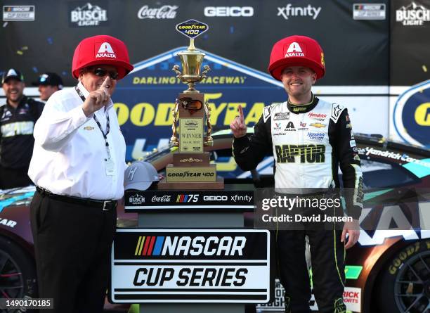 William Byron, driver of the Axalta Throwback Chevrolet and car owner Rick Hendrick celebrates in victory lane after winning the NASCAR Cup Series...