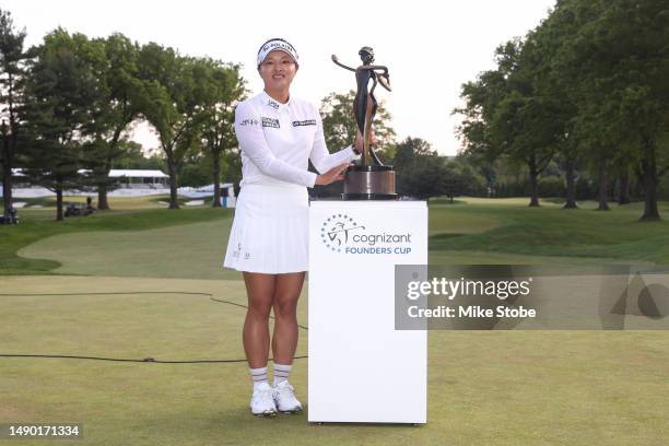 Jin Young Ko of South Korea poses for a photo with the trophy after a playoff win during the final round of the Cognizant Founders Cup at Upper...