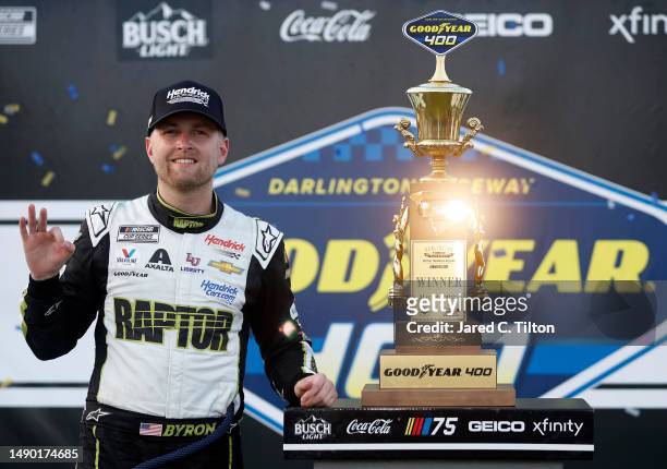 William Byron, driver of the Axalta Throwback Chevrolet, celebrates in victory lane after winning the NASCAR Cup Series Goodyear 400 at Darlington...