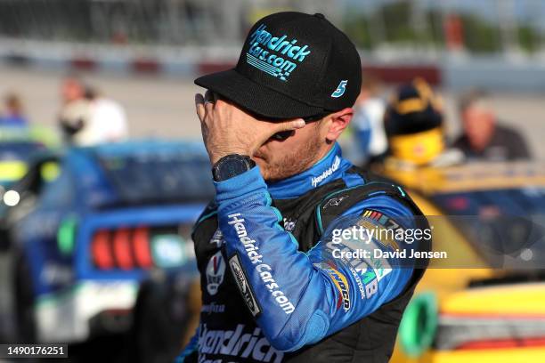 Kyle Larson, driver of the HendrickCars.com Throwback Chevrolet, reacts after getting out of his car following the NASCAR Cup Series Goodyear 400 at...