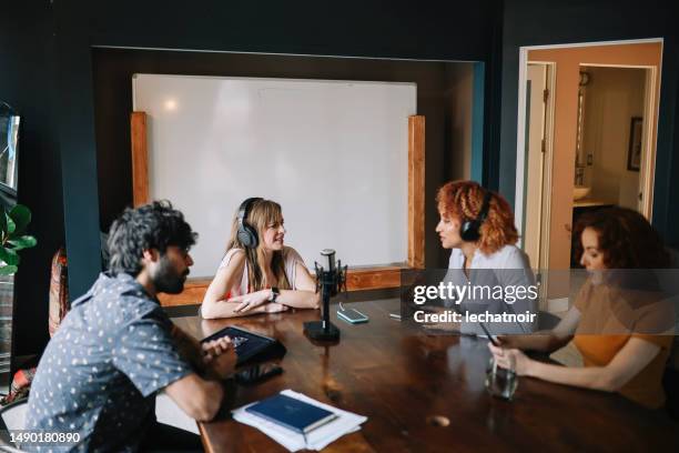 group of people in a live podcast show - los angeles press stock pictures, royalty-free photos & images