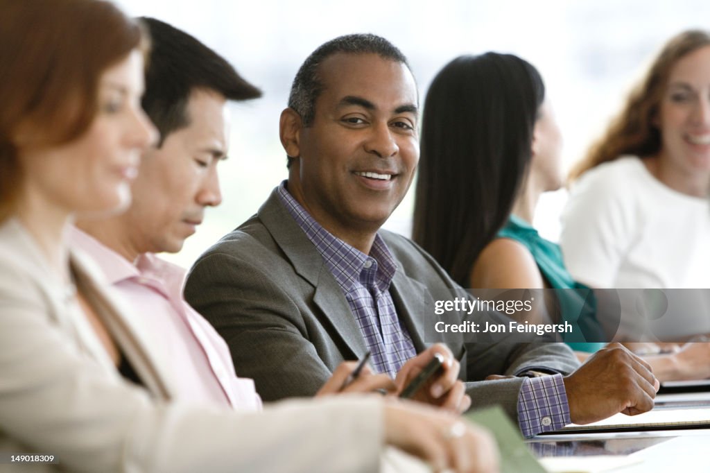 Businessman smiling at meeting