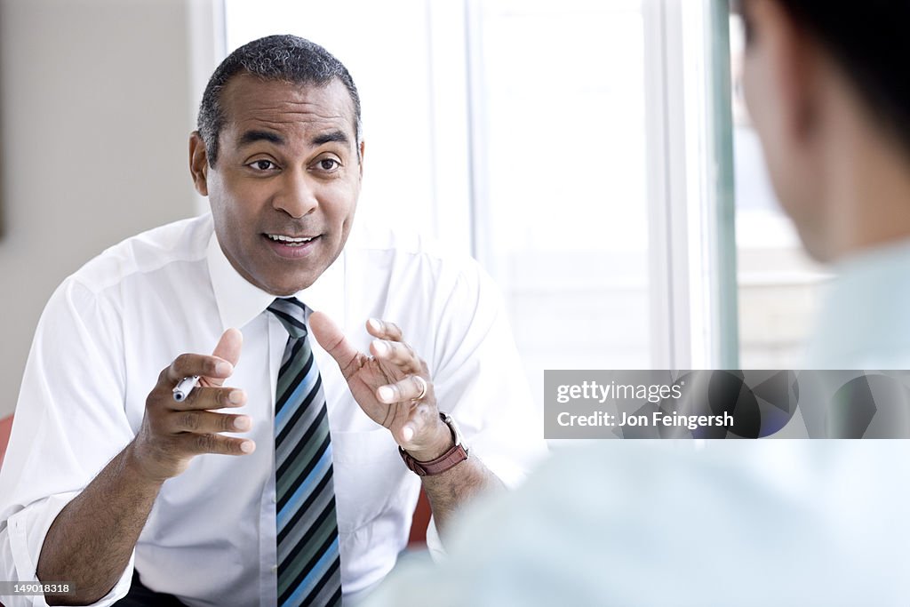 Businessman talking and gesturing