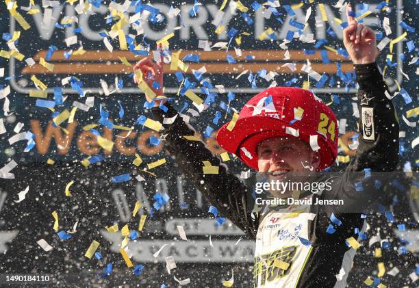 William Byron, driver of the Axalta Throwback Chevrolet, celebrates in victory lane after winning the NASCAR Cup Series Goodyear 400 at Darlington...