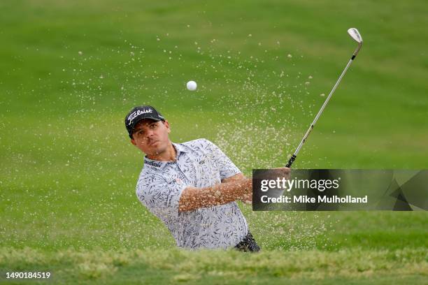 Joseph Bramlett of the United States plays his shot from the bunker on the 10th hole during the final round of the AT&T Byron Nelson at TPC Craig...