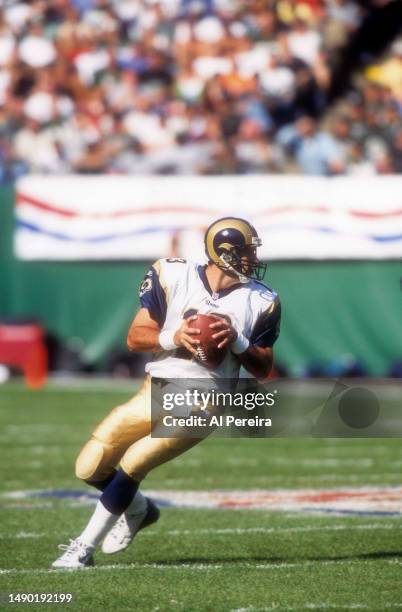 Quarterback Kurt Warner of the St. Louis Rams drops back to pass the ball in the game between the St. Louis Rams vs the New York Jets at The...