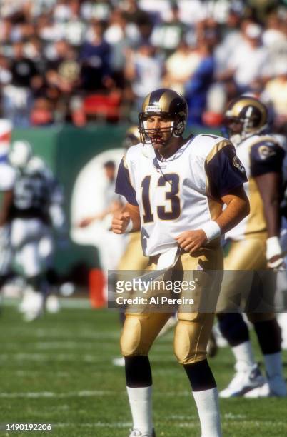 Quarterback Kurt Warner of the St. Louis Rams cheers on his teammates in the game between the St. Louis Rams vs the New York Jets at The Meadowlands...