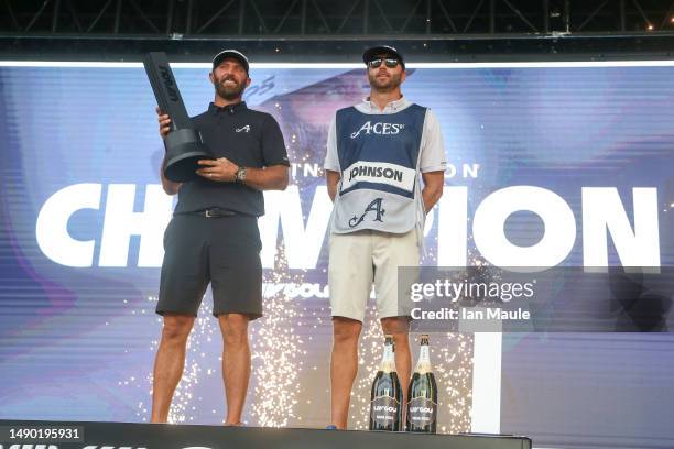 Dustin Johnson of Aces GC celebrates with his caddie and brother, Austin Johnson, after winning the LIV Golf-Tulsa individual championship during Day...