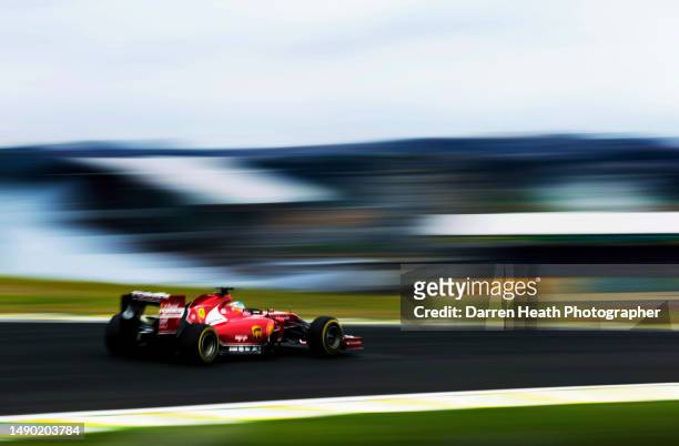 Spanish Scuderia Ferrari Racing Formula One racing team racing driver Fernando Alonso driving his F14 T car at speed during practice for the 2014...