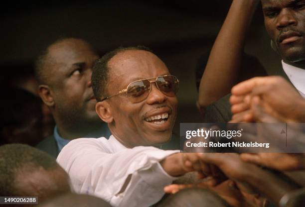 Former Haitian President Jean-Bertrand Aristide as he greets supporters during the national election, Tabarre, Port-au-Prince, Haiti, May 18, 2000.