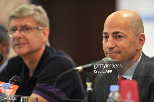 Chief Executive of Arsenal football club Ivan Gazidis speaks while Arsenal manager Arsene Wenger looks on during a press conference at a hotel in...