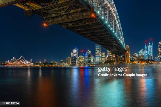 scene of sydney cityscape riverbank with sydney harbor bridge and sydney opera house at the twilight time - time blocking stock pictures, royalty-free photos & images