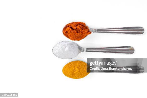 spices and herbs in silver spoons isolated on white background - paprika stock pictures, royalty-free photos & images