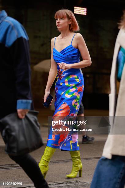 Kate Peck wearing blue print silk dress and green leather boots at Afterpay Australian Fashion Week 2023 at Carriageworks on May 15, 2023 in Sydney,...