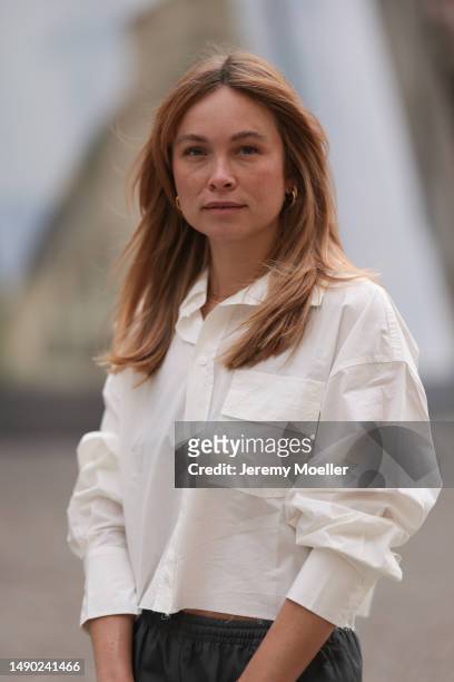 Nadine Berneis seen wearing Vival Studio cargo dark grey pants, Vival Studio cropped beige flannel on May 14, 2023 in Berlin, Germany.