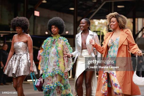 Aiyana Alexander wearing silver mini dress, a guest wearing Alemais and Malaan Ajang wearing silver rider jacket, white split skirt at Afterpay...