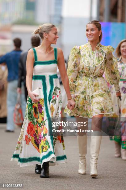 Ava Simpson Alemais dress and Ellipse Simpson wearing Alemais dress at Afterpay Australian Fashion Week 2023 at Carriageworks on May 15, 2023 in...