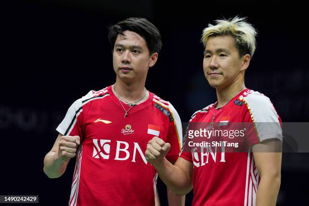 Marcus Fernaldi Gideon and Kevin Sanjaya Sukamuljo of Indonesia celebrate the victory in the Men's Doubles Round Robin match against Kevin Lee and Ty...