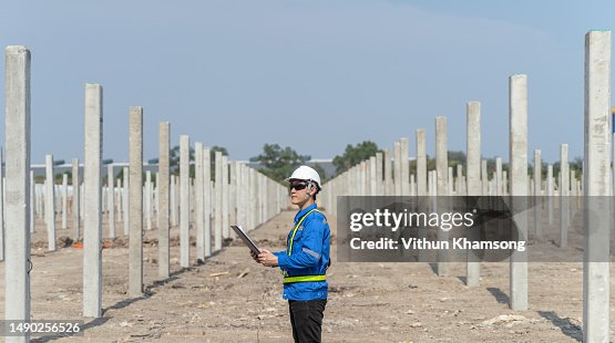 Males engineer checking progress and structure at construction site. Males engineer checking progress and structure at construction site.