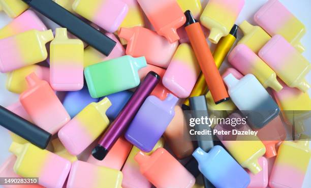 recycling bin containing used vapes - vaping danger stock pictures, royalty-free photos & images