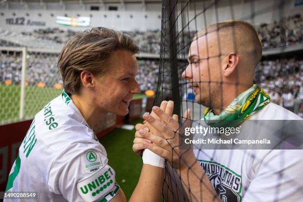 Hammarby's August Mikkelsen celebrates in front of supporters after an Allsvenskan match between Hammarby IF and Djurgardens IF at Tele2 Arena on May...