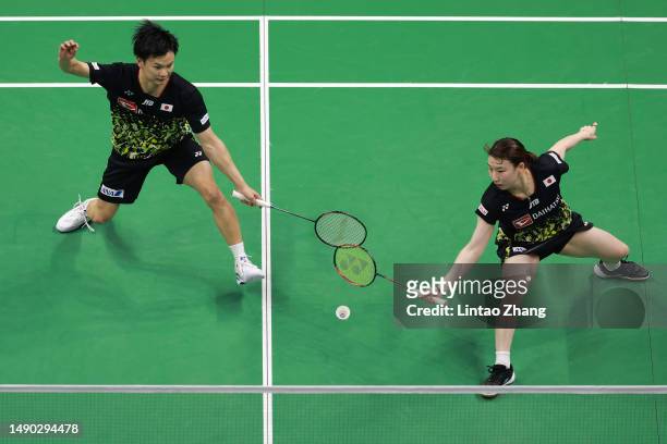 Yuta Watanabe and Arisa Higashino of Japan compete in the Mixed Doubles second round match against Delphine Delrue and Gicquel Thom of France during...