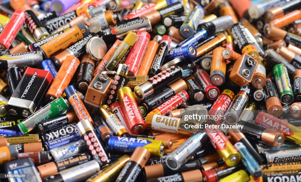 Recycling bin full of used batteries