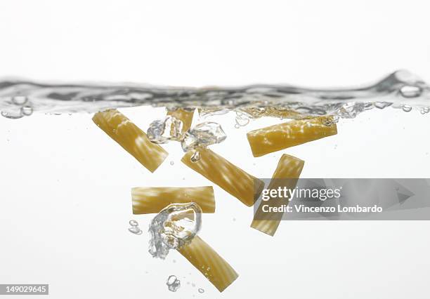 pasta in boiling water - boiling pasta stock pictures, royalty-free photos & images