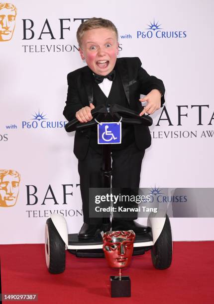 Lenny Rush poses in the Winner's Room with the Male Performance in a Comedy Programme Award for 'Am I Being Unreasonable?' during the 2023 BAFTA...