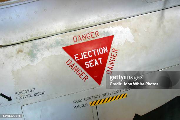 danger ejection seat painted sign on the side of an airplane. - australian airforce stock pictures, royalty-free photos & images