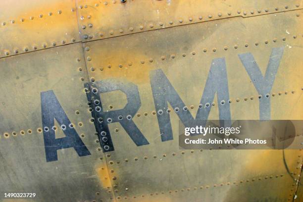 army sign painted on rustic metal plating. - rivet stock pictures, royalty-free photos & images