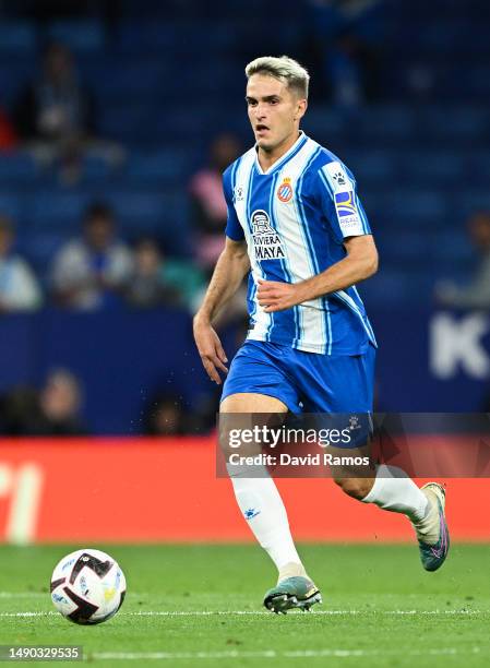 Denis Suarez of RCD Espanyol runs with the balls the LaLiga Santander match between RCD Espanyol and FC Barcelona at RCDE Stadium on May 14, 2023 in...