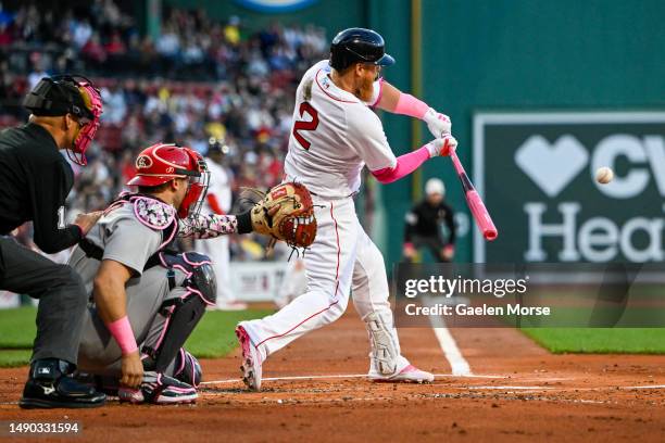 Justin Turner of the Boston Red Sox hits the ball in the first inning against the St. Louis Cardinals at Fenway Park on May 14, 2023 in Boston,...