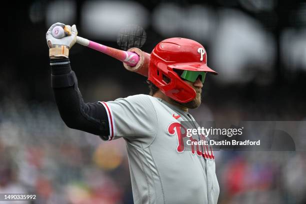 Bryce Harper of the Philadelphia Phillies warms up before batting in the first inning of a game against the Colorado Rockies at Coors Field on May...